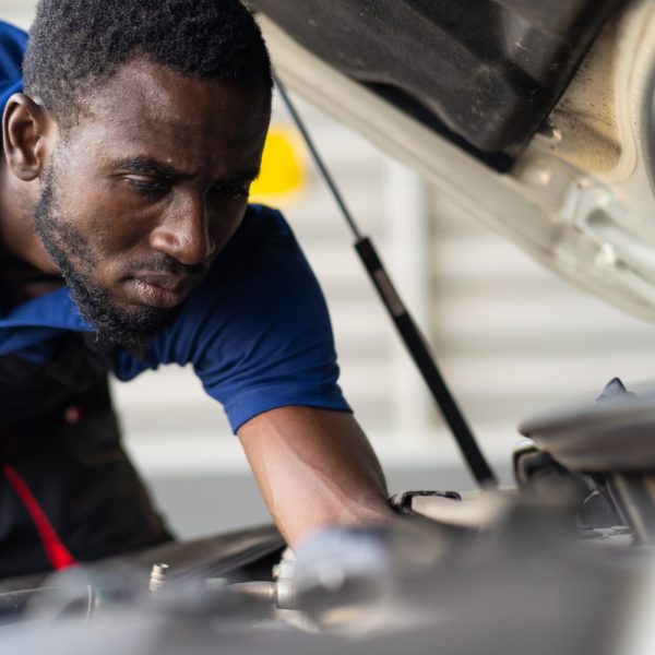 black-male-mechanic-repairs-car-garage-car-maintenance-auto-service-garage-concept